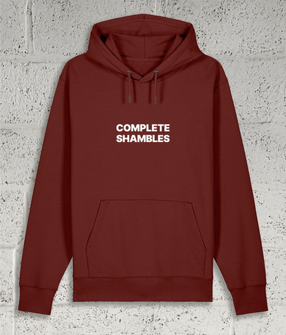 Front view of Shambles Studio COMPLETE SHAMBLES red hoodie with graphic
