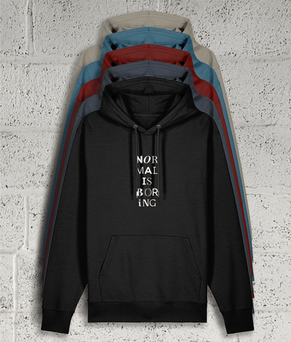 Front view of Shambles Studio NORMAL IS BORING hoodie with graphic showing 5 colour variants